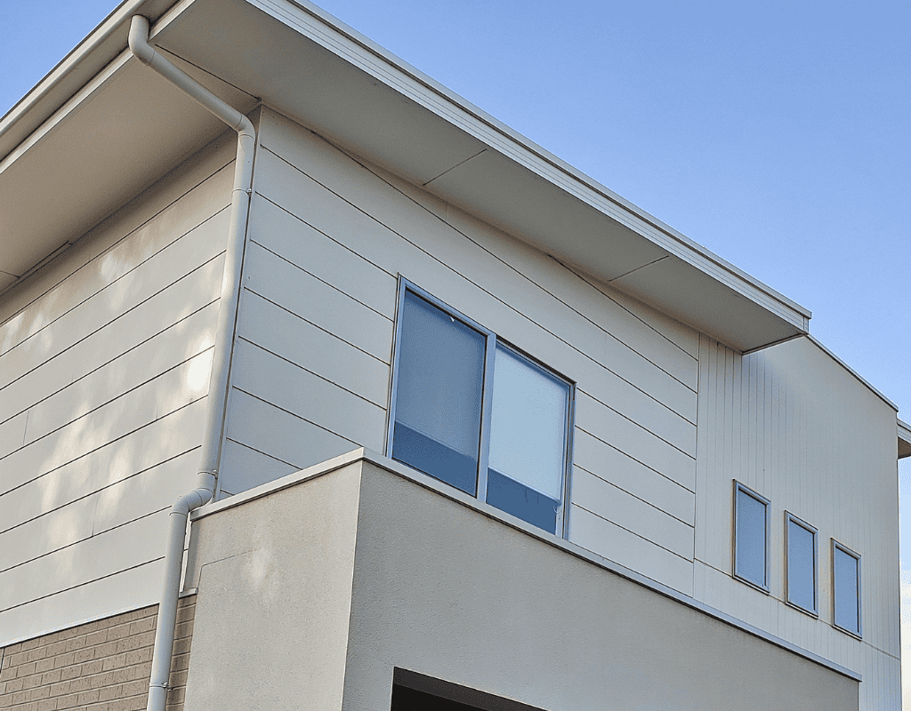 Modern home exterior with new siding panels and roof installed by Chicagoland contractor
