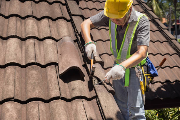 Roof Repair in Naperville - IL in progress as a technician reseals flashing around a roof vent